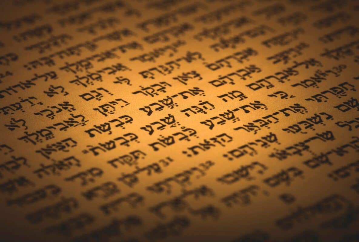 Ancient Hebrew biblical text from Song of Songs (Shir Hashirim) on aged parchment scroll, close-up with warm sepia lighting, evoking timeless romantic poetry and cultural roots of modern Israeli love slang like "choleh al" and "met al".